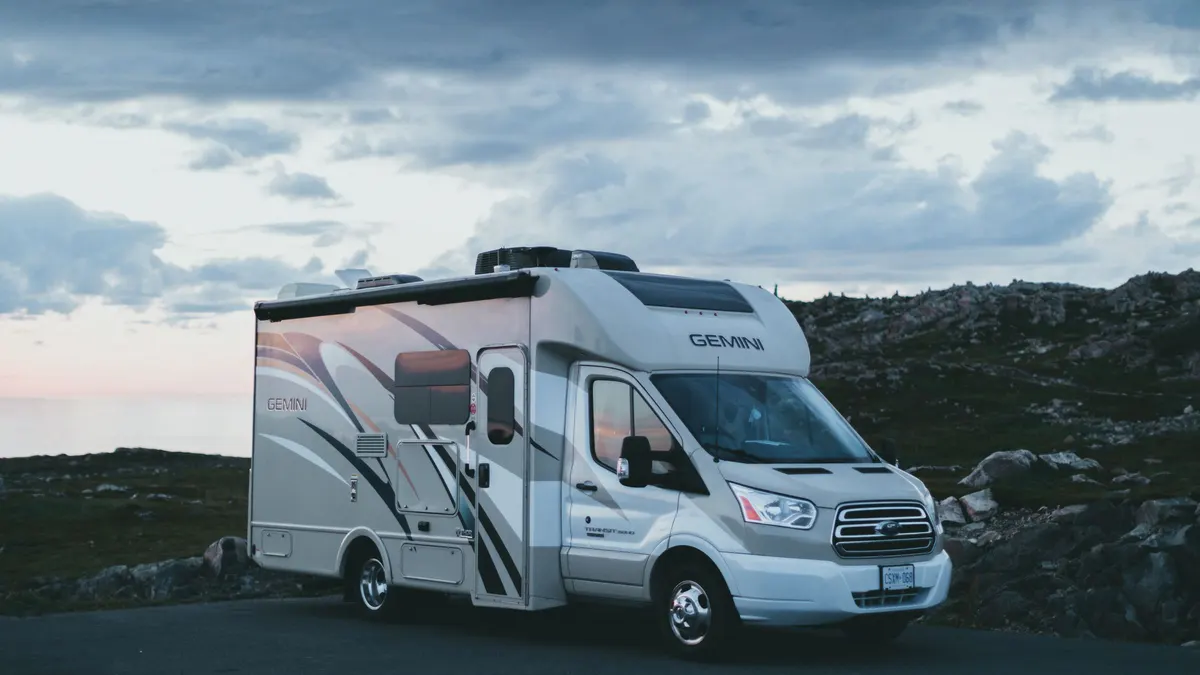 Class C motorhome parked at a mountain overlook