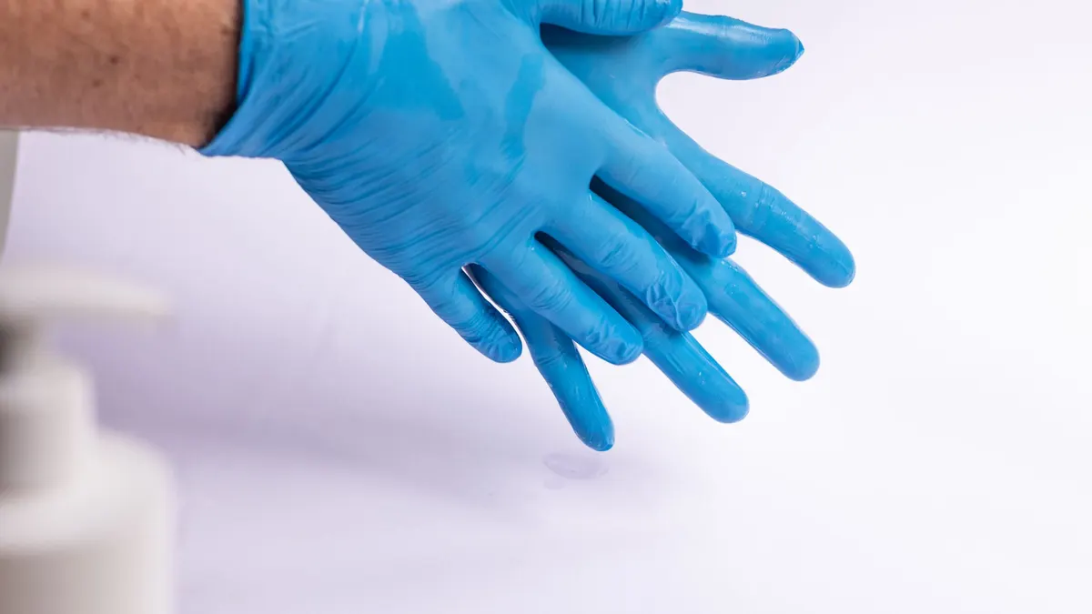 Blue disposable gloves on a white surface