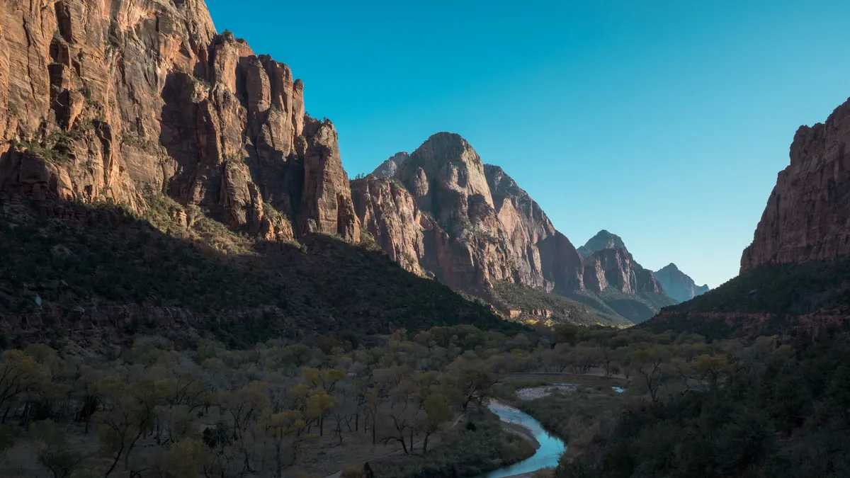 River winding through a deep canyon between sandstone walls