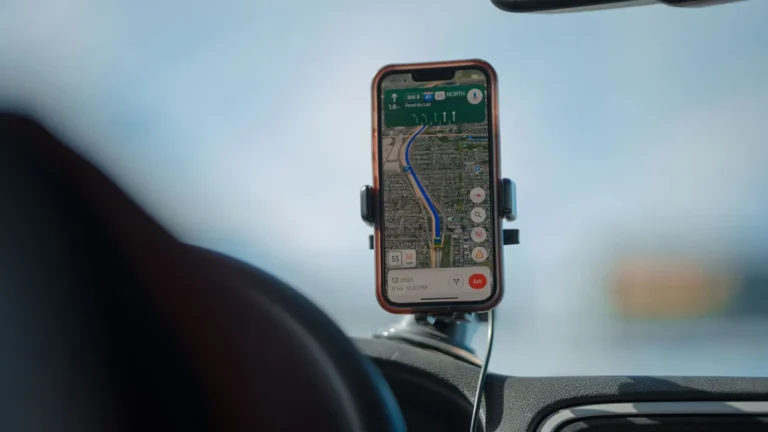 Phone showing a map in a dashboard mount while driving