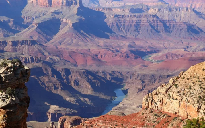 Layered canyon walls with a river far below
