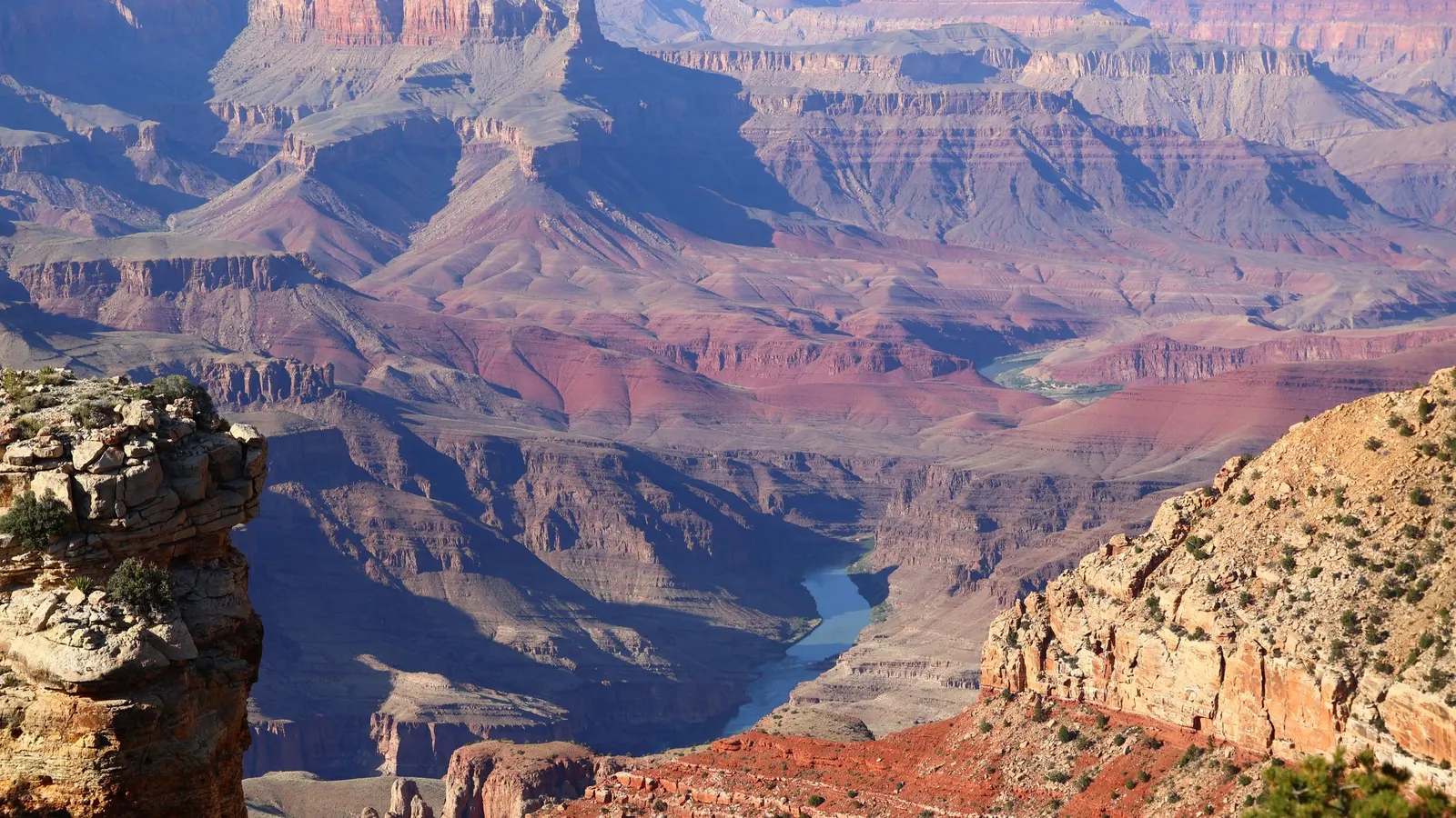 Layered canyon walls with a river far below