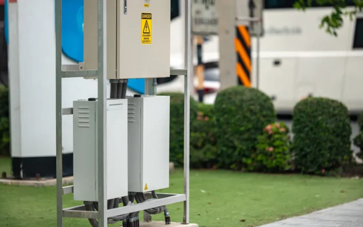 Campground electrical pedestals beside parked RVs