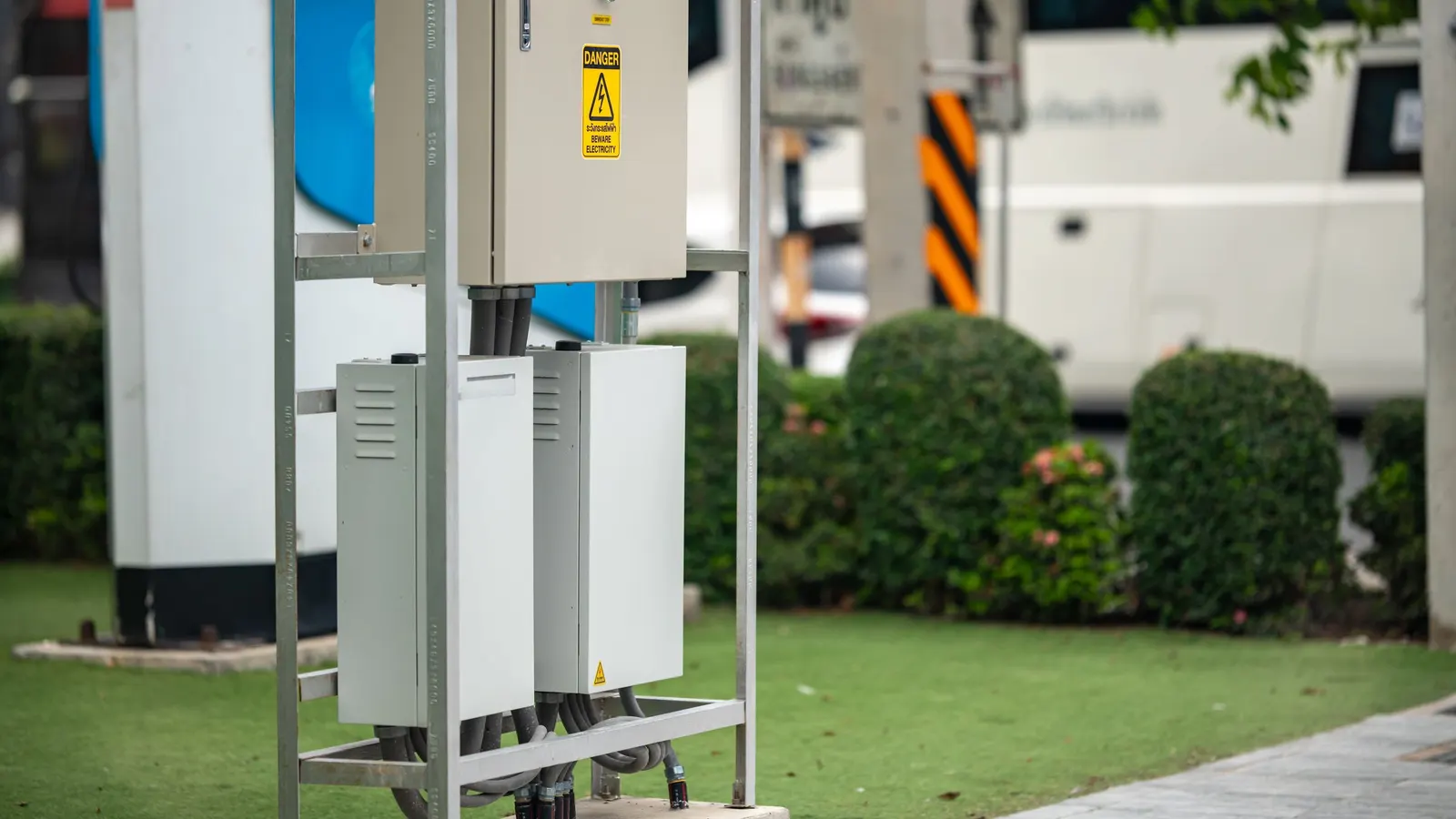 Campground electrical pedestals beside parked RVs