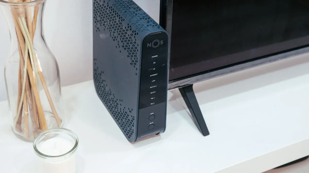 Home-style WiFi router on a white shelf
